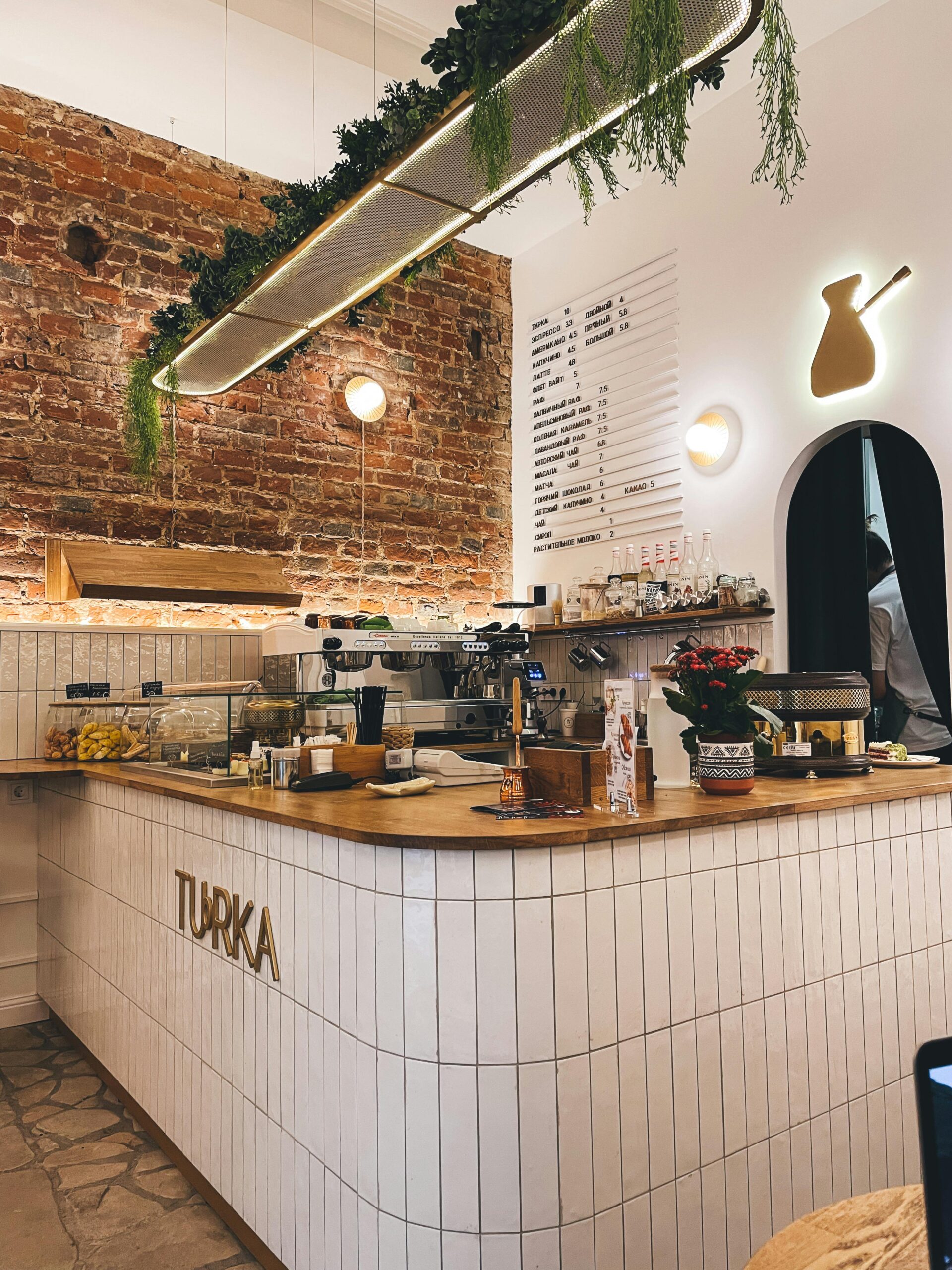 Charming Paris café with modern design and rustic brick walls.